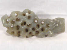 Appraisal: A jade carving of a scholars rock cm long