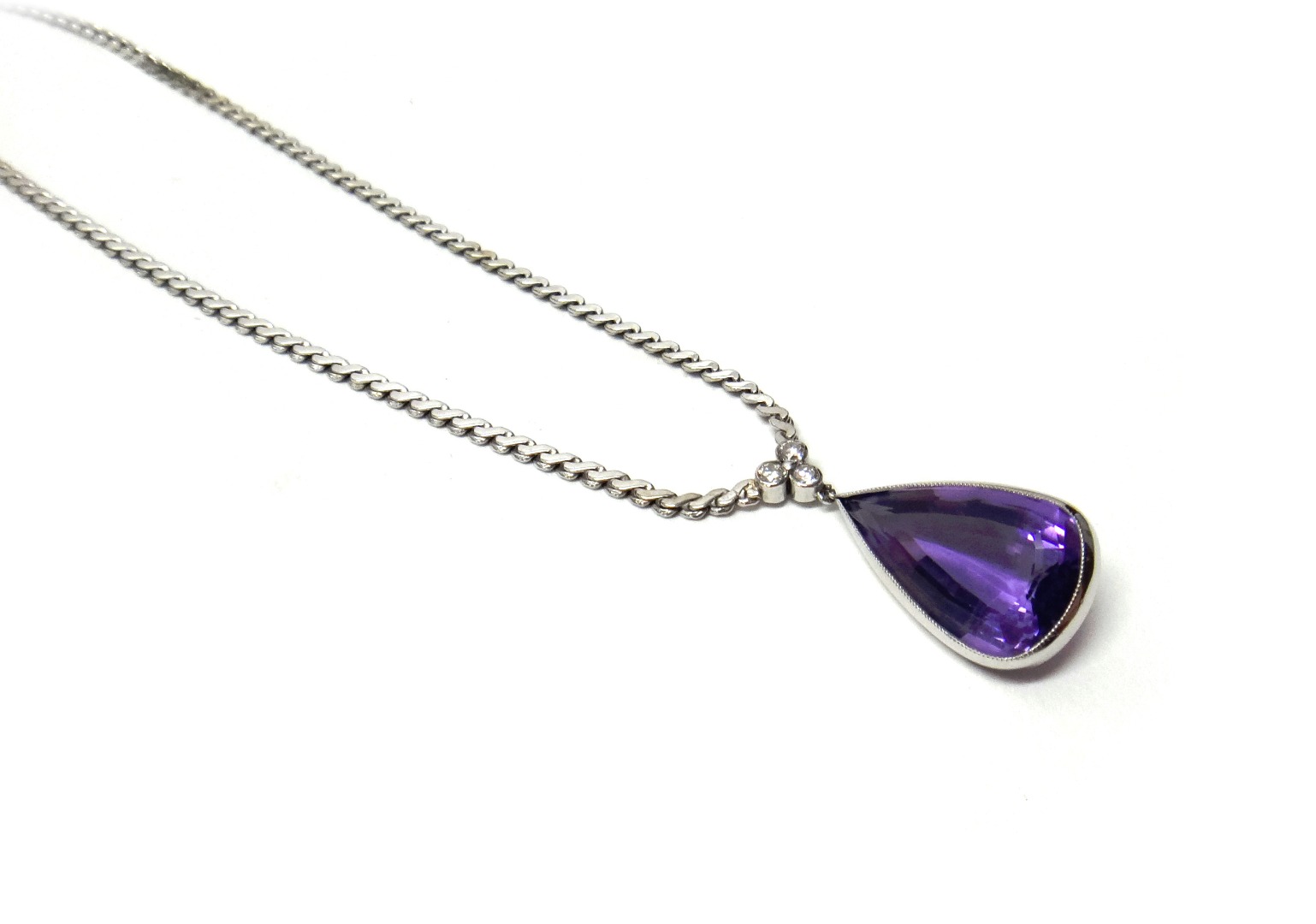 Appraisal: An amethyst and diamond necklace mounted with a pear shaped