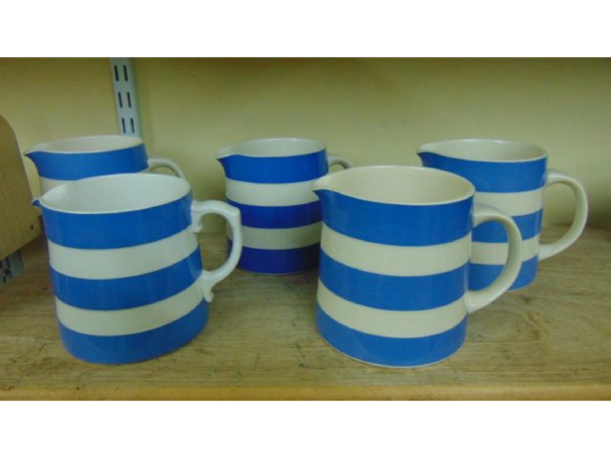 Appraisal: Five T G Green blue and white banded Cornishware milk