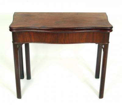 Appraisal: AN EARLY GEORGE III MAHOGANY FOLDING TEA TABLE of serpentine