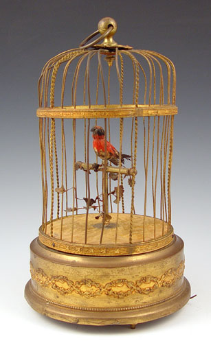 Appraisal: GERMAN SINGING BIRD AUTOMATON Animated bird head pivots tail moves