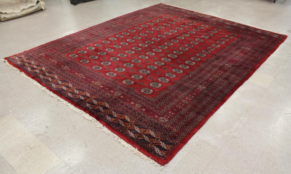 Appraisal: HAND KNOTTED BOKHARA CARPET six columns of geometric Turkman gols