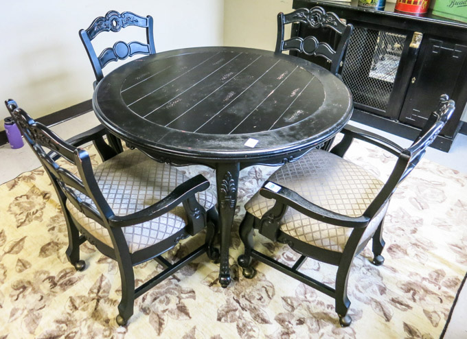 Appraisal: EBONIZED PROVINCIAL STYLE DINING TABLE AND CHAIR SET Powell Furniture