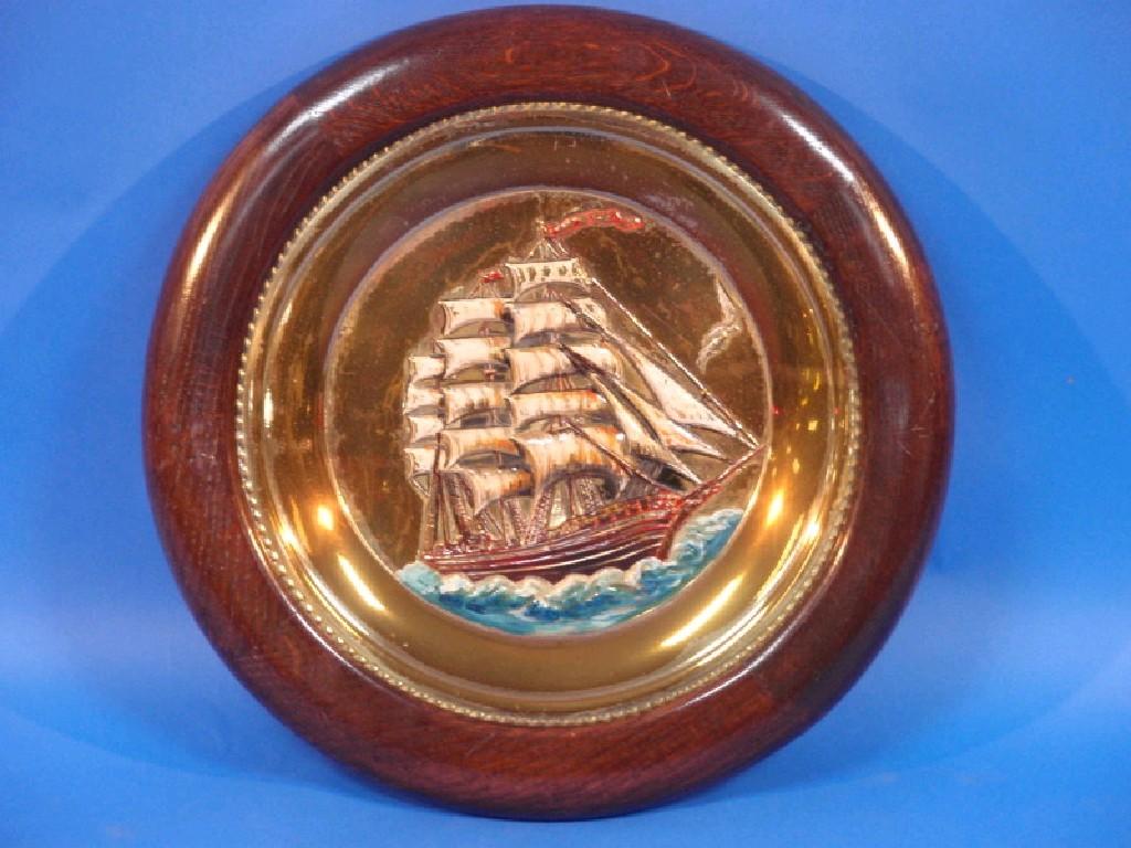 Appraisal: A brass circular charger embossed with a sailing ship and