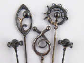 Appraisal: Five silver hat pins of Art Nouveau design each with