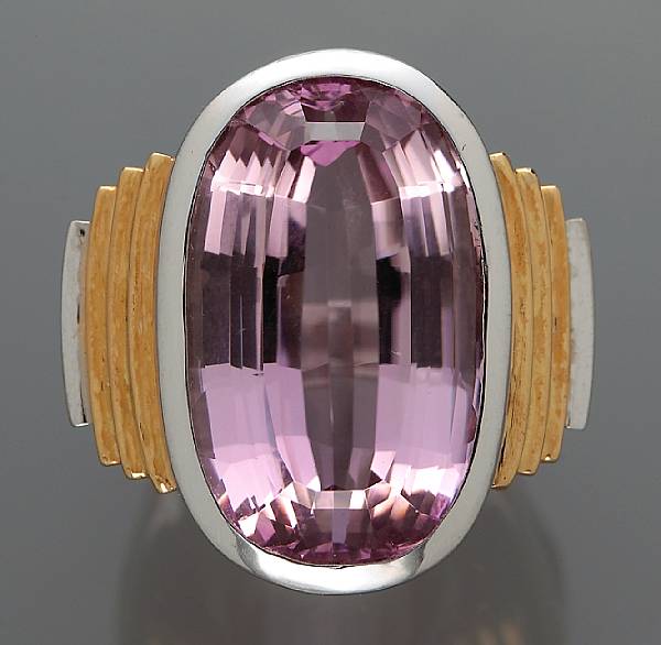 Appraisal: A kunzite ring centering a oval-shaped kunzite measuring approximately x