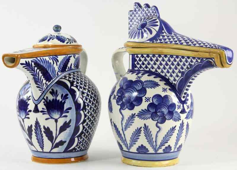 Appraisal: Pair of Austrian Pottery Pitcherseach with long spout one with