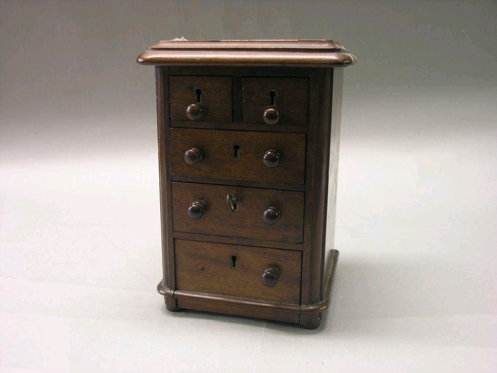 Appraisal: A Victorian miniature mahogany chest of drawers two short and