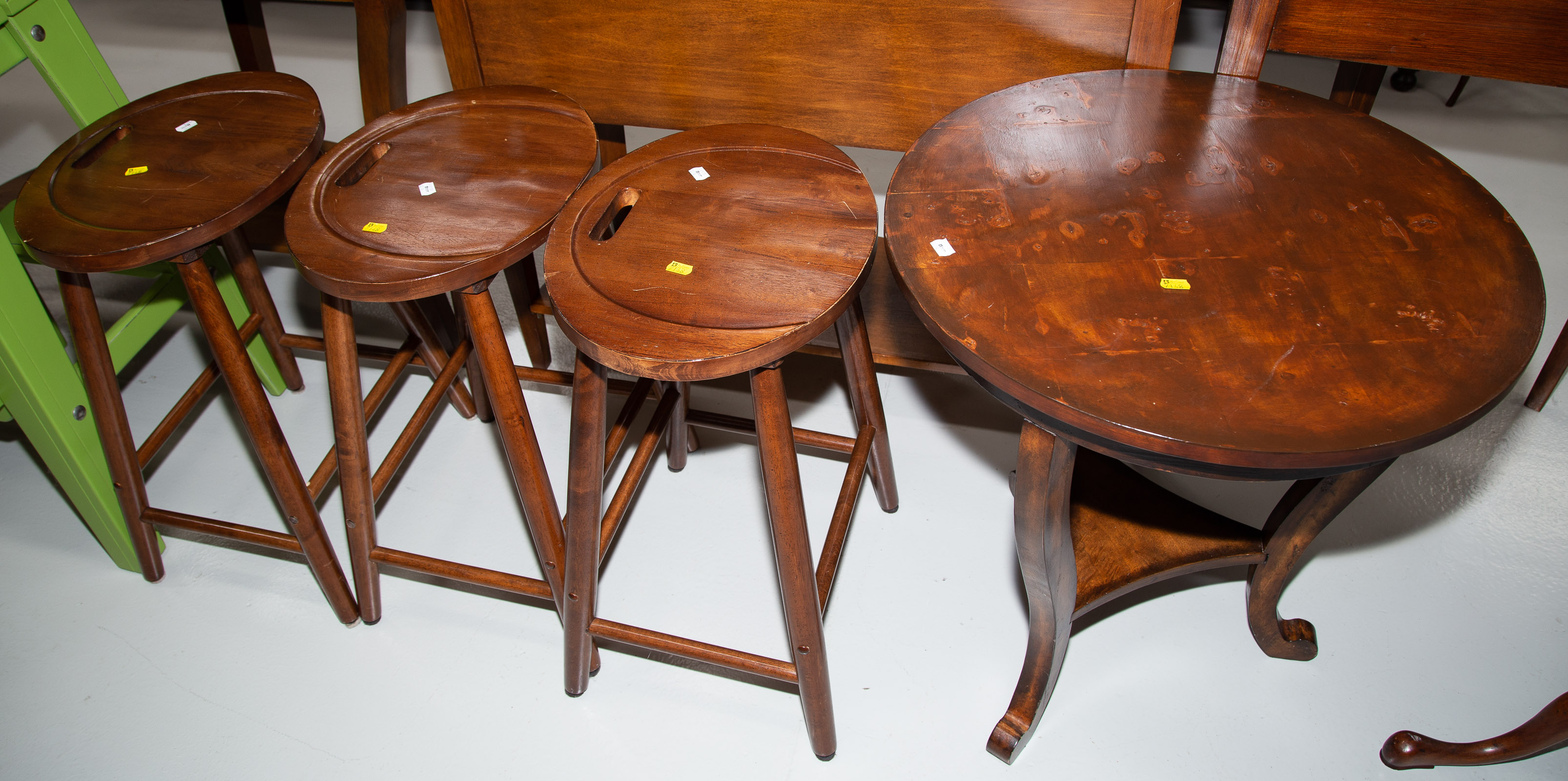 Appraisal: THREE BARSTOOLS CENTER TABLE Comprising of three mahogany barstools with