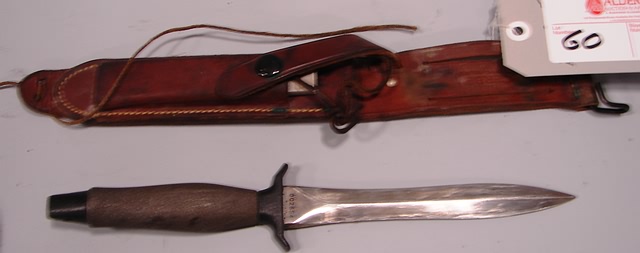 Appraisal: Lot consists of a US fighting knife made by GERBER