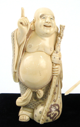 Appraisal: A JAPANESE HEAVY IVORY CARVING OF HOTEI the figure with