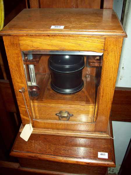 Appraisal: A ONE DOOR ENGLISH OAK PIPE SMOKERS BOX