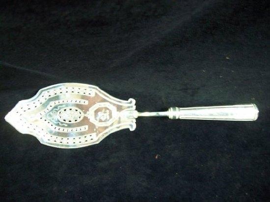 Appraisal: A late th Century Irish fish slice with pierced and