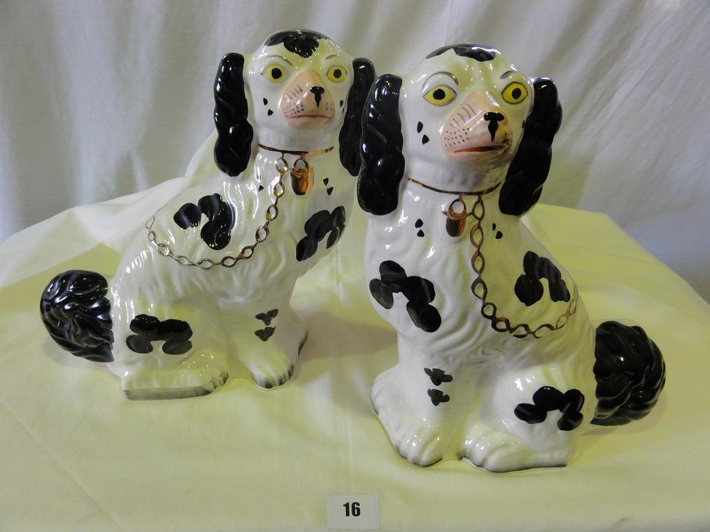 Appraisal: A pair of Arthur Wood Staffordshire style spaniels with black