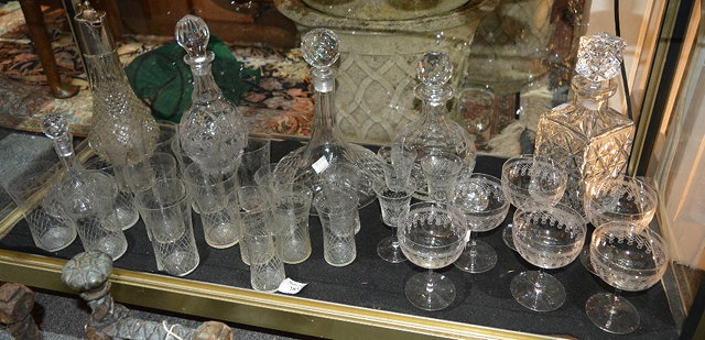 Appraisal: A collection of glasswareto include etched champagne tumblers decanters and