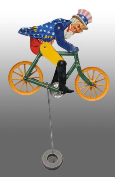 Appraisal: Tin Litho Uncle Sam Bicycle Toy Description American Beautiful lithography