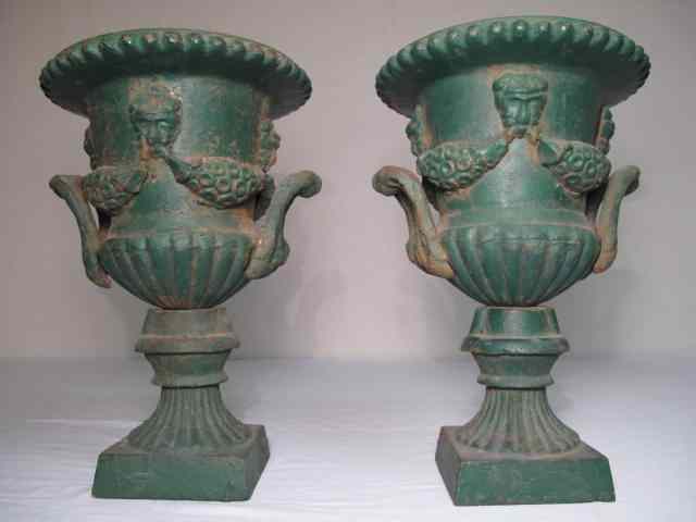 Appraisal: Pair of heavy cast iron garden planters Applied handles decor