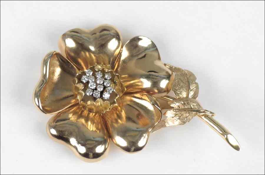 Appraisal: DIAMOND AND KARAT YELLOW GOLD FLOWER BROOCH round brilliant diamonds