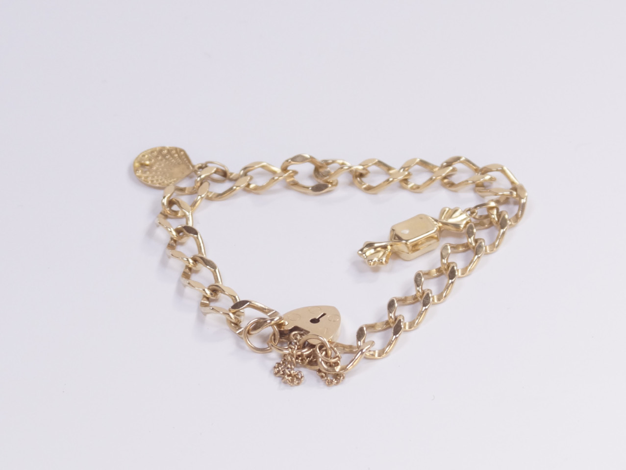 Appraisal: A yellow metal bracelet with ct gold padlock clasp and