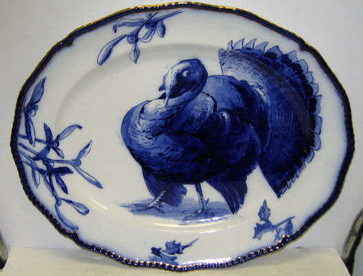 Appraisal: ROYAL DOULTON FLOW BLUE TURKEY PLATTER Shaped oval painted turkey