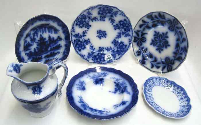 Appraisal: ELEVEN PIECES ENGLISH FLOWING BLUE SEMI-PORCELAIN four matching soup bowls