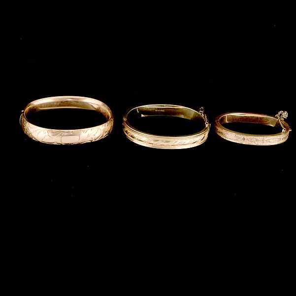 Appraisal: Trio of Gold Filled Bangle Bracelets A trio of Bangles