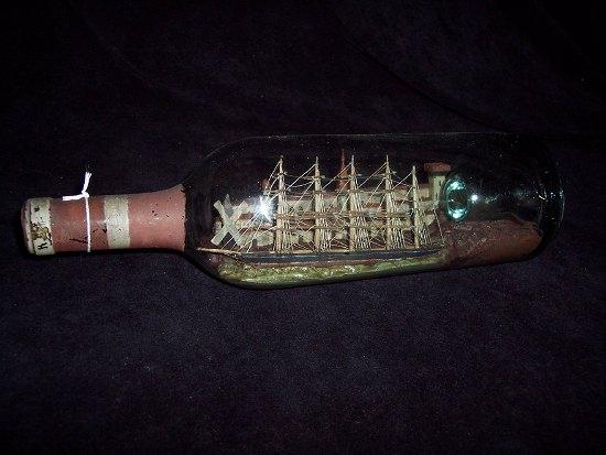 Appraisal: A late th Century five-mast ship in a bottle with