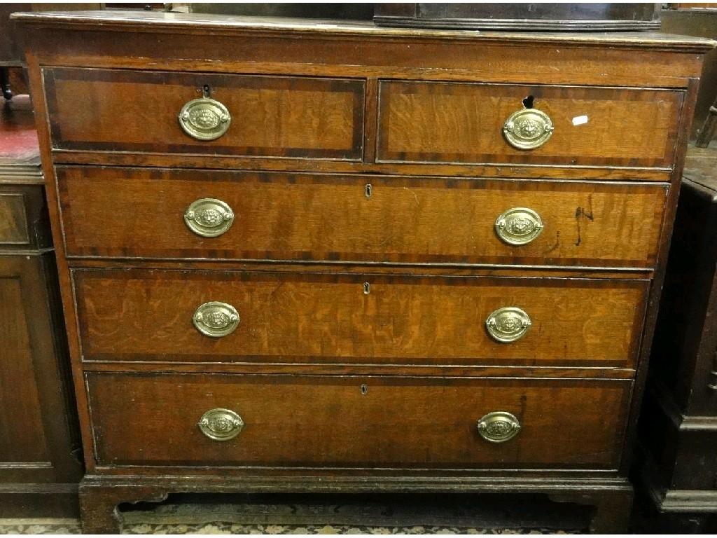 Appraisal: A Georgian oak and mahogany cross banded chest fitted with