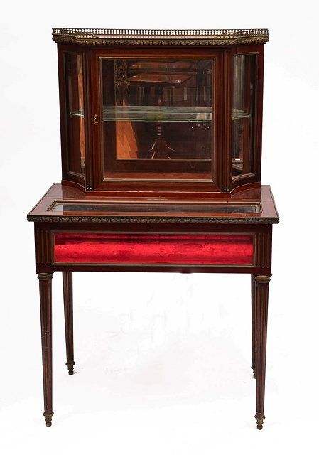 Appraisal: A FRENCH MAHOGANY AND BRASS INLAID BIJOUTERIE CABINET IN TWO