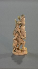 Appraisal: A Japanese carved ivory figure of a fishmonger cm