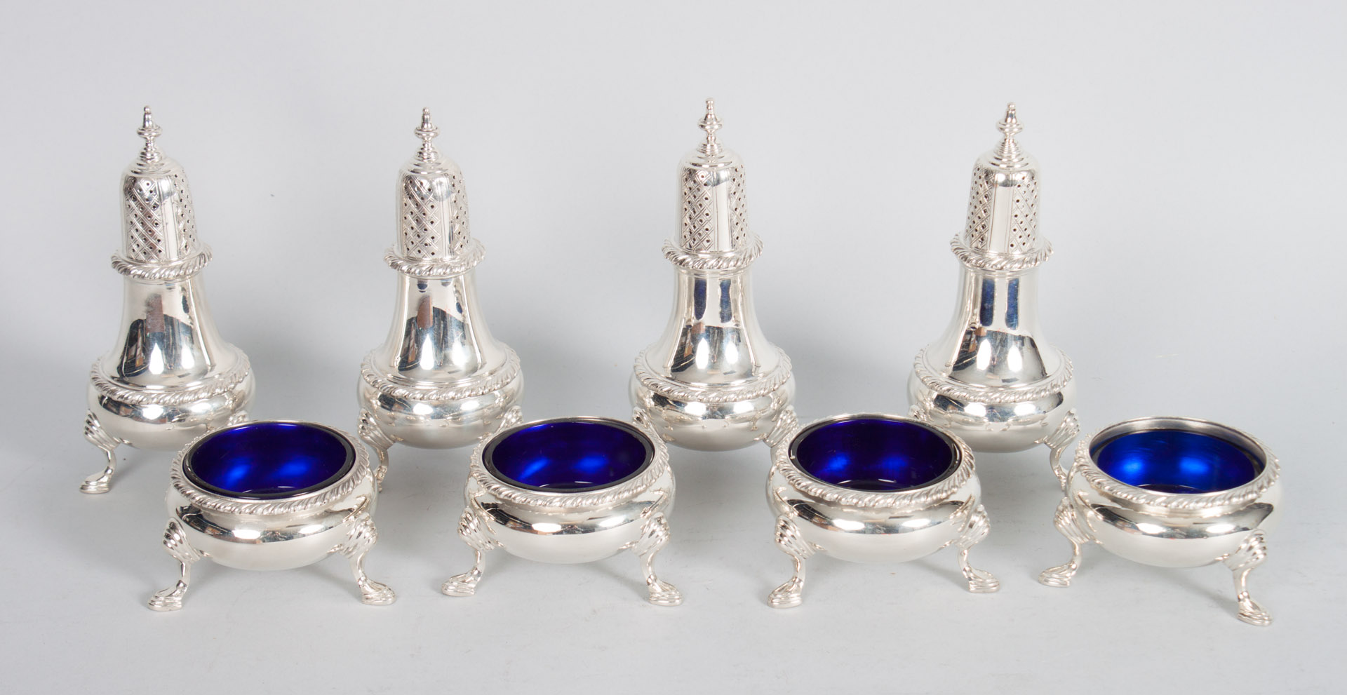 Appraisal: Four silver salt cellars and pepper shakers unidentified American maker