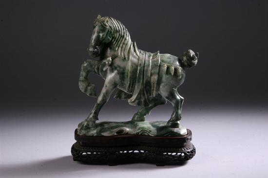 Appraisal: CHINESE WHITE AND SPINACH JADE FIGURE OF HORSE Carved with