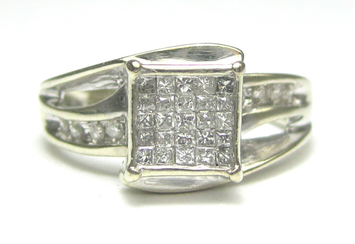 Appraisal: DIAMOND AND TEN KARAT WHITE GOLD RING set with princess-cut