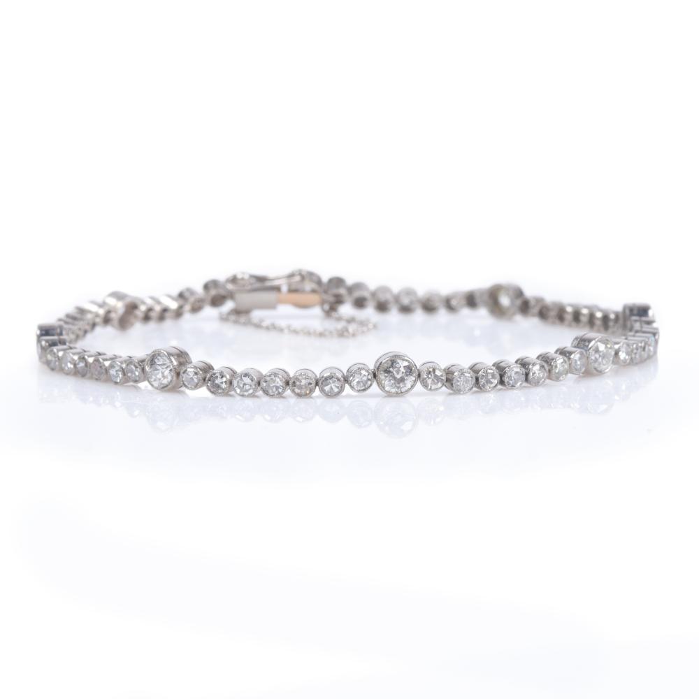 Appraisal: Custom Platinum diamond station tennis bracelet containing Old European Mine