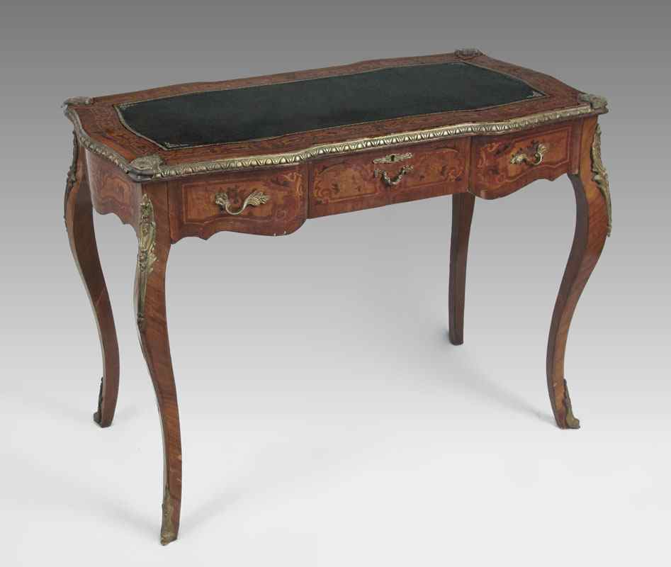 Appraisal: FRENCH ORMOLU LEATHER TOP WRITING TABLE Leather inset with marquetry