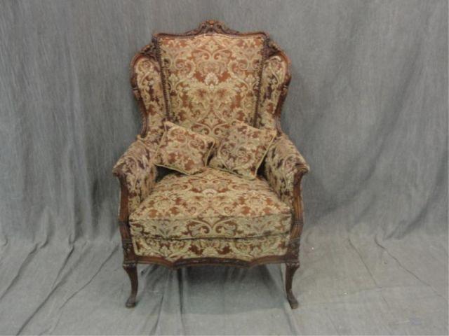 Appraisal: Louis XV Style Carved and Wing Back Upholstered Arm Chair