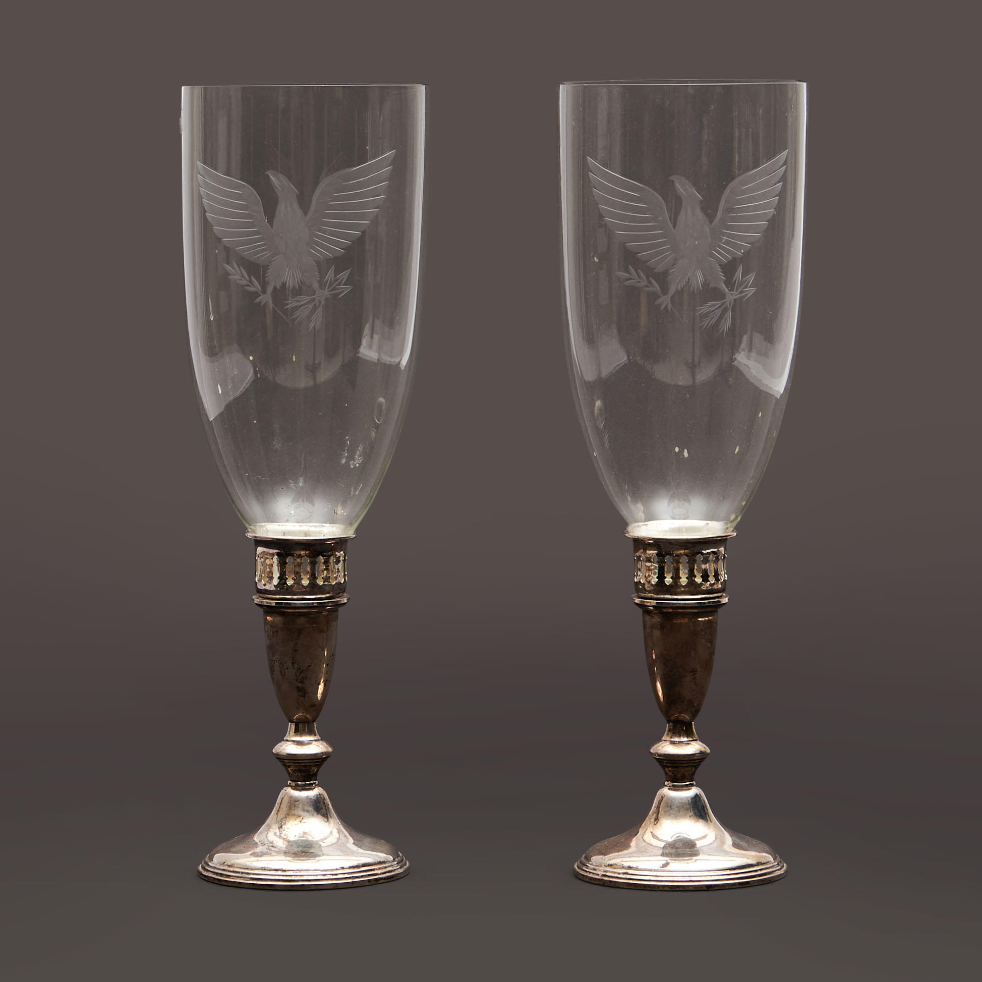 Appraisal: PAIR OF ETCHED GLASS HURRICANE LAMPS ON STERLING SILVER WEIGHTED