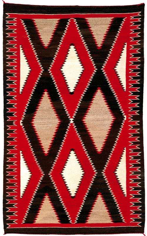 Appraisal: Vibrant Navajo regional rug in red brown and ivory with