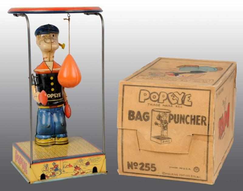 Appraisal: Tin Chein Popeye Overhead Bag Puncher Wind-Up Toy Description American