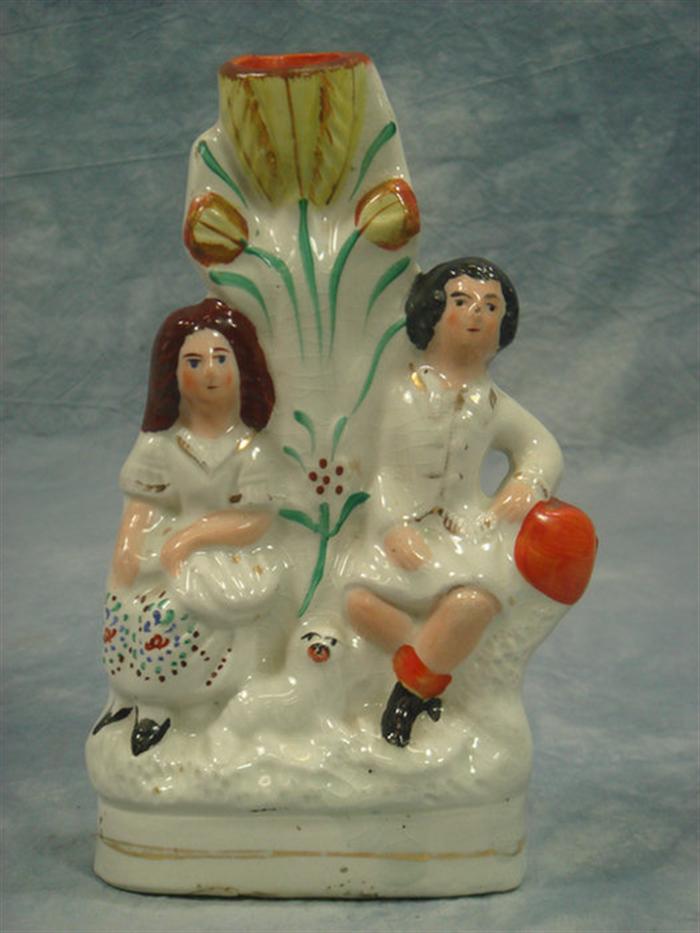 Appraisal: Staffordshire spill vases couple with tulips couple sleeping h Estimate