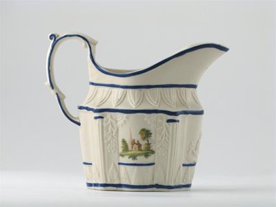 Appraisal: A Castleford moulded jug painted with panels of rural scenes