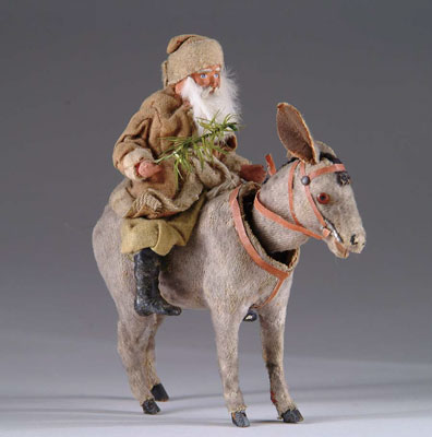 Appraisal: SANTA RIDING NODDING DONKEY A felt covered nodding donkey with