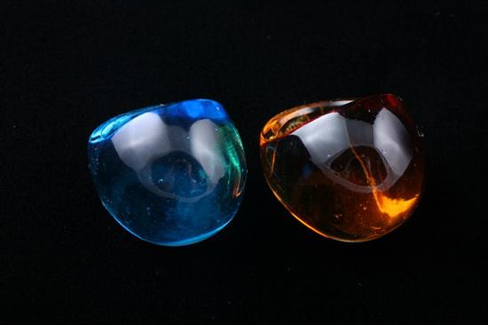 Appraisal: PAIR SIGNED LALIQUE TRANSPARENT COLORED CRYSTAL NERITA DOME RINGS One