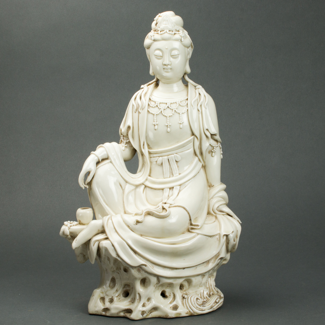 Appraisal: CHINESE BLANC-DE-CHINE FIGURE OF GUANYIN Chinese blanc-de-chine figure of Guanyin