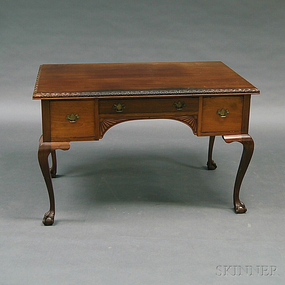 Appraisal: Chippendale-style Carved Mahogany Partner's Desk the rectangular top with molded