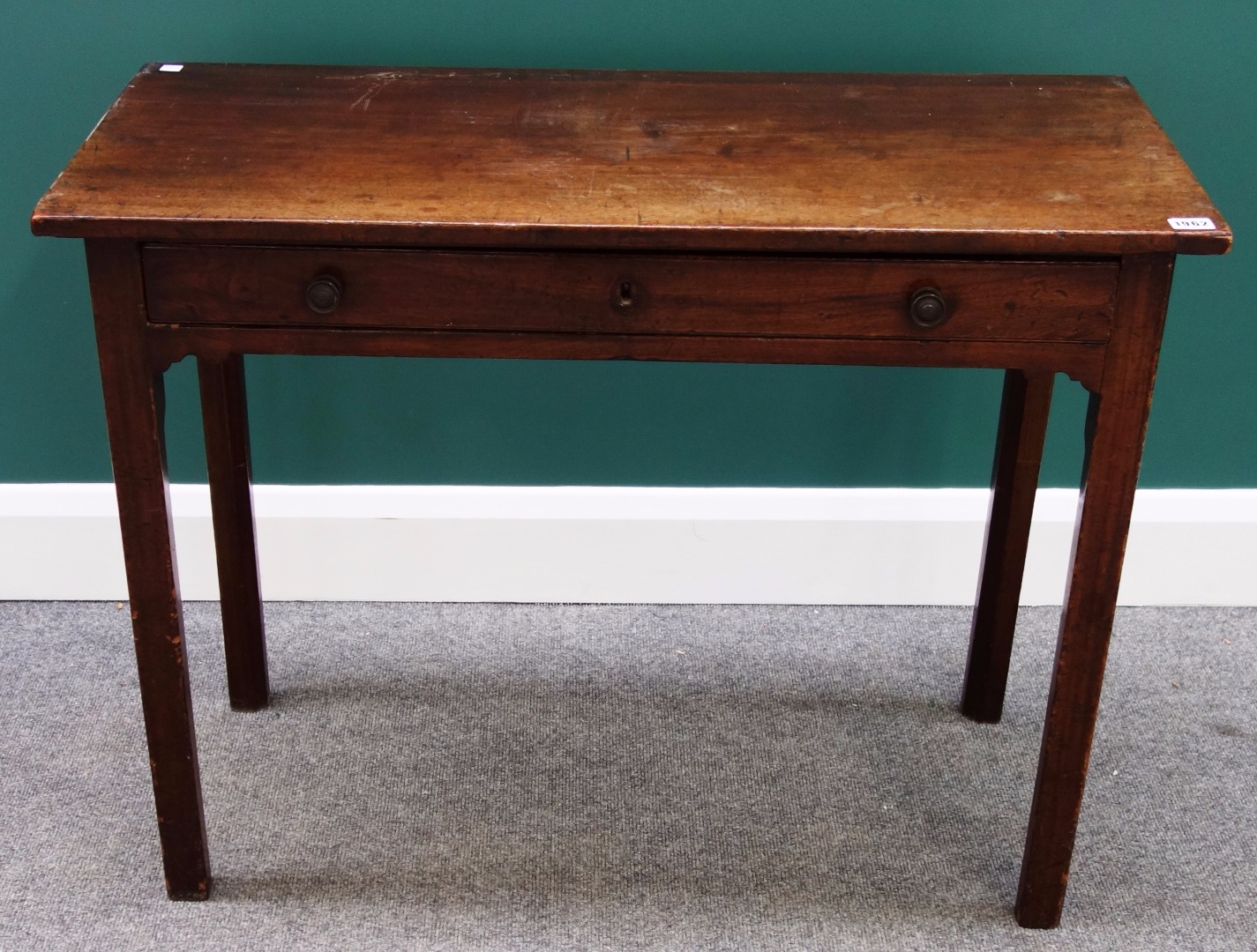 Appraisal: An th century mahogany side table with single frieze drawer