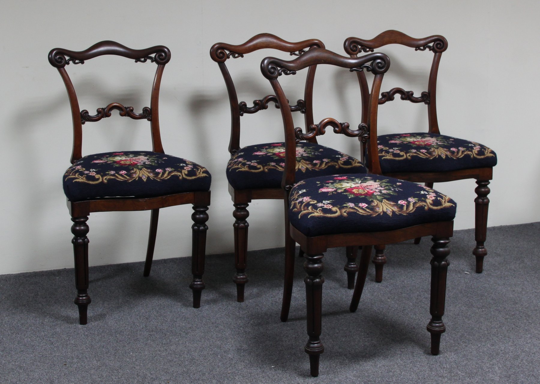 Appraisal: A set of four Victorian simulated rosewood salon chairs the