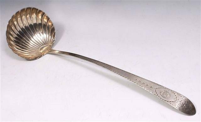 Appraisal: A GEORGE III IRISH SILVER PUNCH LADLE with scallop shell