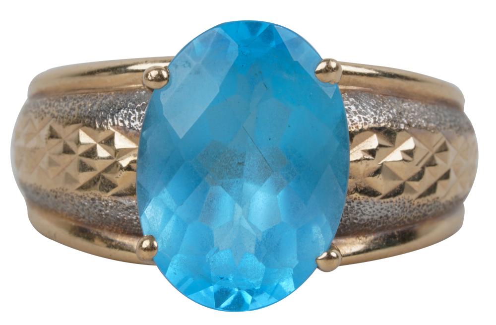 Appraisal: KARAT GOLD BLUE TOPAZ RINGcentering one oval shape checkerboard mixed