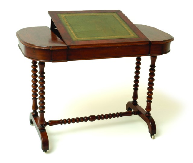 Appraisal: A VICTORIAN WALNUT AND MAHOGANY WRITING DESK The lobed rectangular